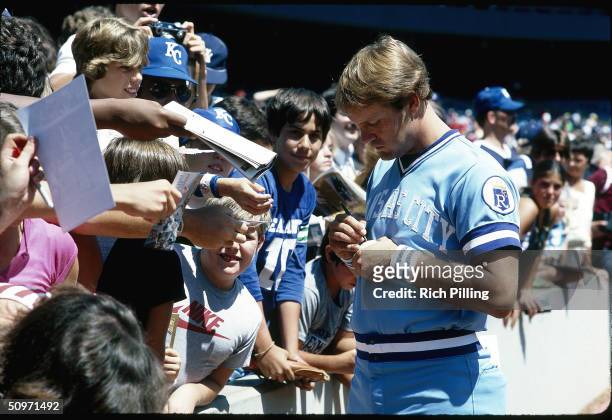 George Brett of the Kansas City Royals signs autographs for fans in 1981.