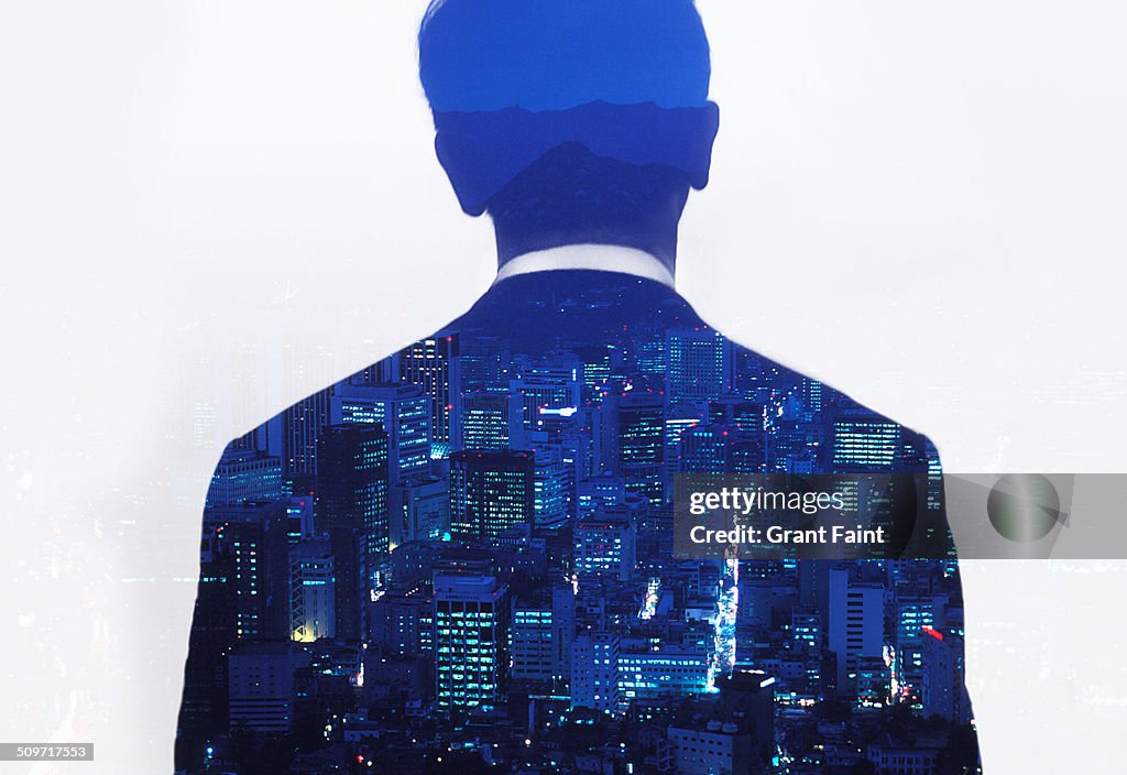 Double exposure:  Seoul skyline and executive