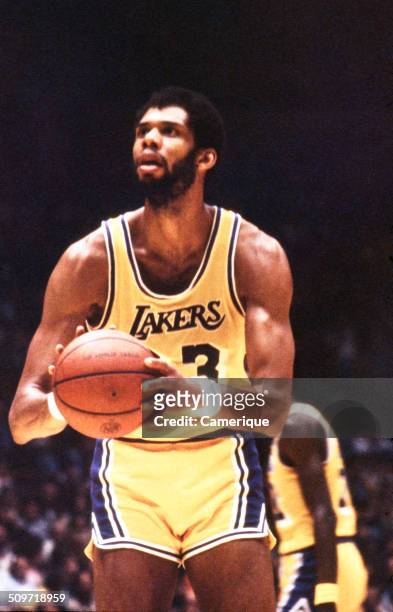 American basketball player Kareem Abdul Jabbar , of the Los Angeles Lakers, lines up a shot, September 1982.