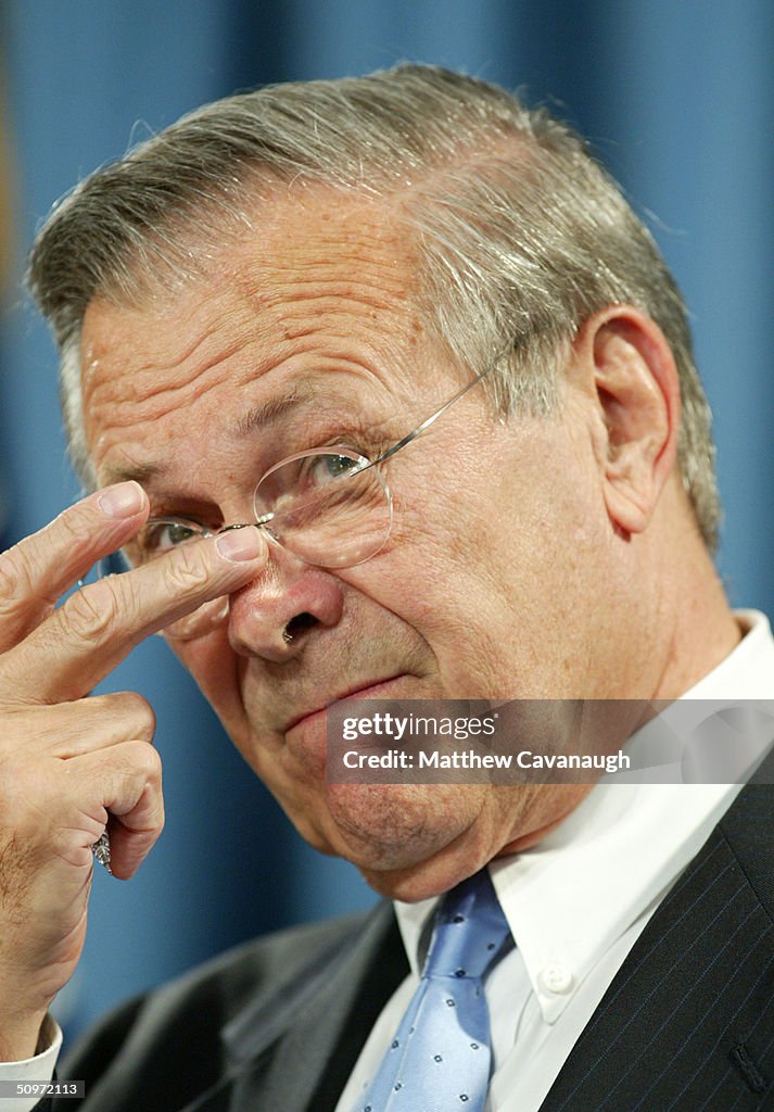 Secdef Rumsfeld U.S. Secretary of Defense Donald Rumsfeld adjusts his glasses during ...