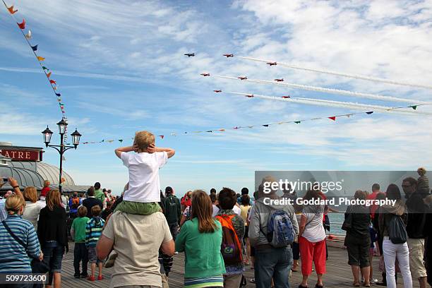 england: red arrows at cromer - red arrow plane stock pictures, royalty-free photos & images