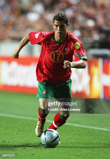 Cristiano Ronaldo of Portugal runs with the ball during the UEFA Euro 2004, Group A match between Russia and Portugal at the Luz Stadium on June 16,...