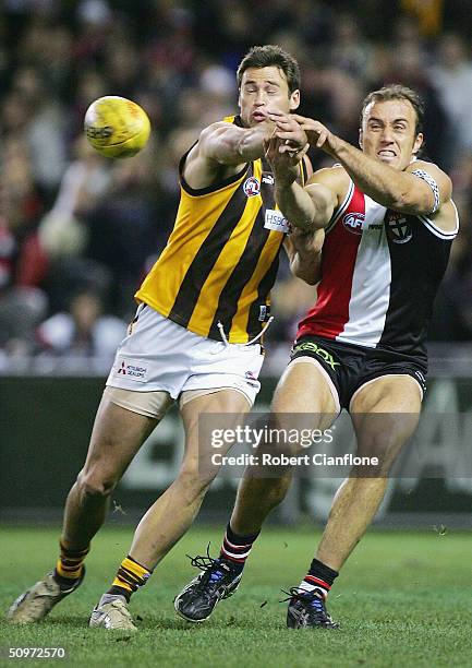 Jonathan Hay of the Saints challenges Fraser Gehrig of the Saints during the round 13 AFL match between the St.Kilda Saints and the Hawthorn Hawks at...