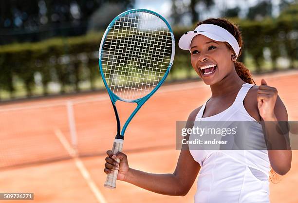 female tennis player winning - playing tennis stock pictures, royalty-free photos & images