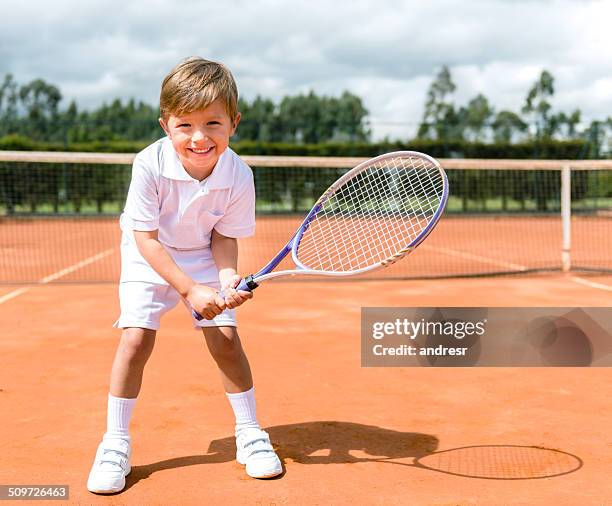 boy playing tennis - racquet sport stock pictures, royalty-free photos & images