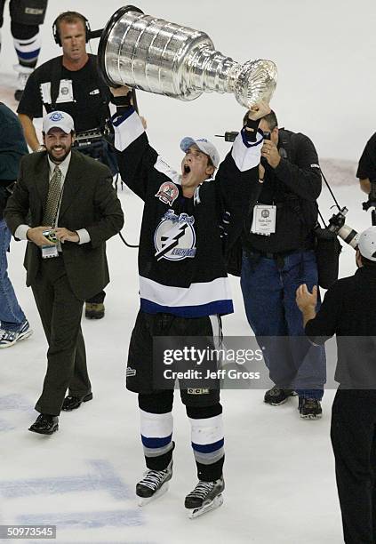 Center Vincent Lecavalier of the Tampa Bay Lightning holds the Stanley Cup above his head after defeating the Calgary Flames in Game seven of the NHL...