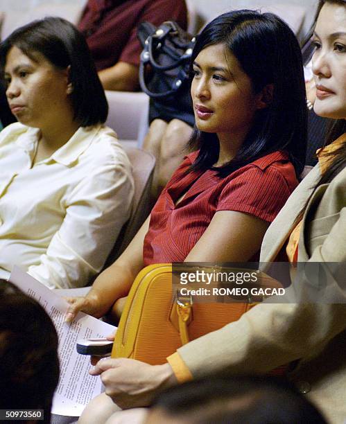 Popular Filipina sexy movie actress Joyce Jimenez attends the joint senate and congressional count of the presidential elections at the House of...
