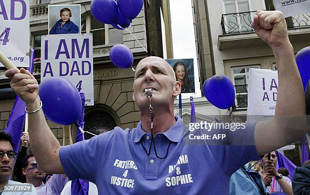 Members of "Fathers 4 Justice" demonstrate during their march to Westminster, London, 18 June 2004 demanding more rights for fathers. AFP...