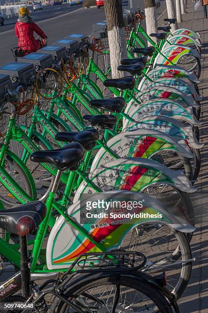 rental bikes are parked on the street, beijing - lancashire hotpot stock pictures, royalty-free photos & images