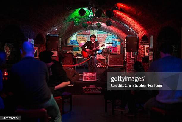 An artist sings to tourists in the Cavern Club where The Beatles played in their early years on February 11, 2016 in Liverpool, England. New research...