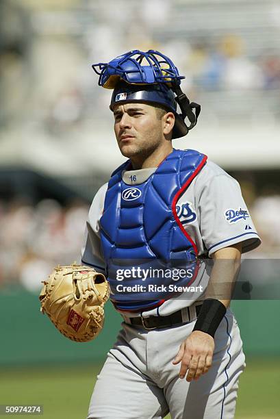 Catcher Paul LoDuca of the Los Angeles Dodgers with his catchers helmet on his head during the game against the Pittsburgh Pirates on May 9, 2004 at...