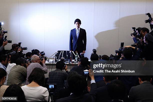 Lower House member Kensuke Miyazaki stands to apologise in a news conference on February 12, 2016 in Tokyo, Japan. A ruling Liberal Democratic Party...