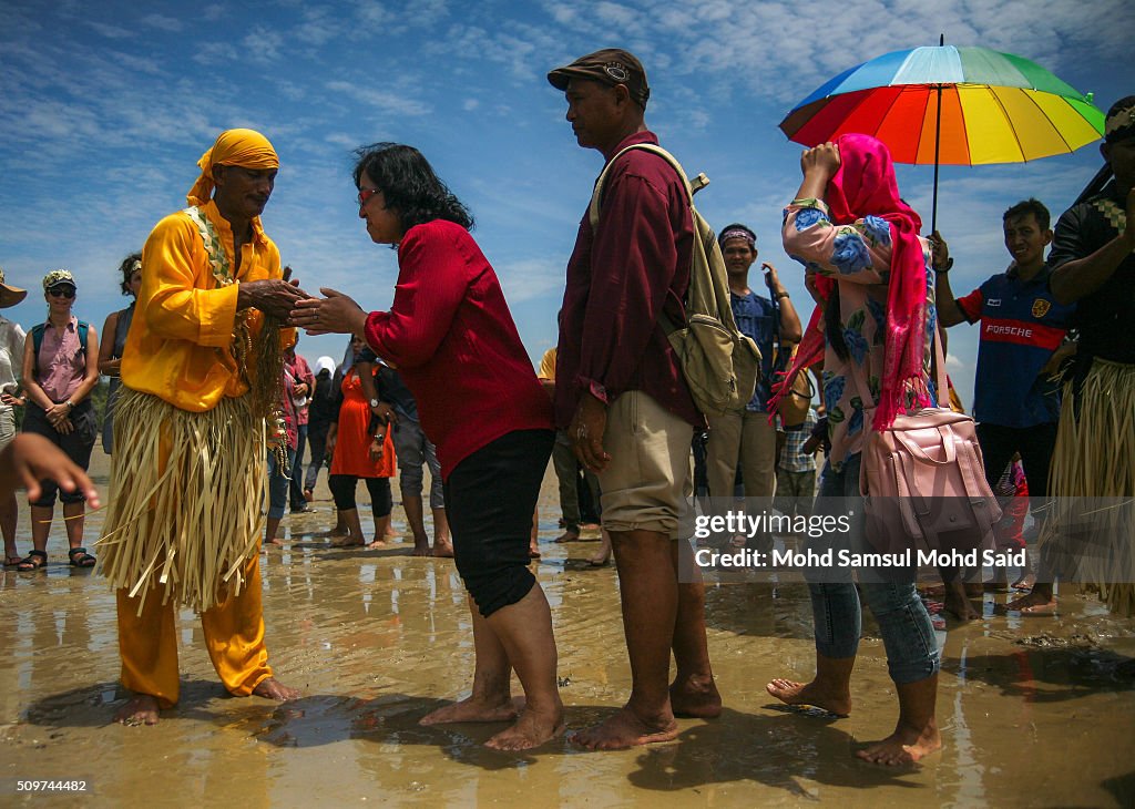 Macuri Ritual People shake hands with a shaman after performing a ritual prayer ...