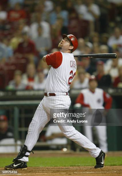 Sean Casey of the Cincinnati Reds follows the hit during the game against the Colorado Rockies on May 19, 2004 at Great American Ballpark in...