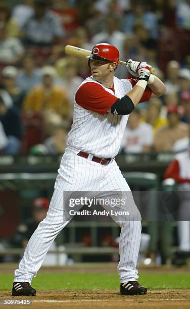 Adam Dunn of the Cincinnati Reds stands ready at bat during the game against the Colorado Rockies on May 19, 2004 at Great American Ballpark in...