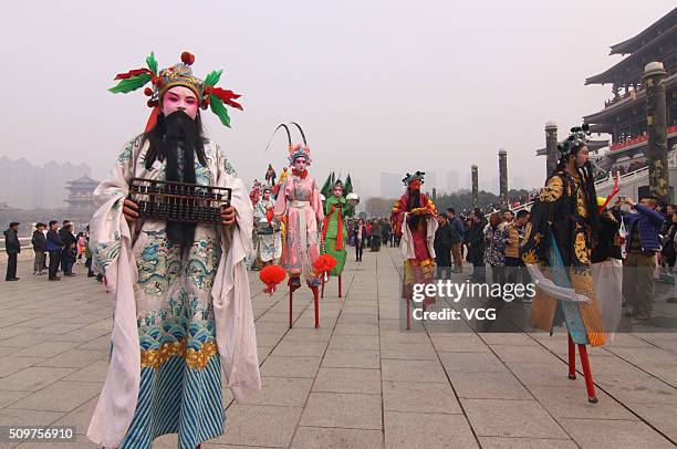 Folk artists perform during the Shehuo parade to celebrate the lunar new year at Datang Furong Garden on February 11, 2016 in Xi'an, Shaanxi Province...