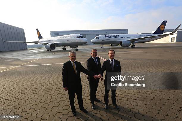 Robert Leduc, president of Pratt & Whitney, left, Carsten Spohr, chief executive officer of Deutsche Lufthansa AG, center, and Fabrice Bregier, chief...
