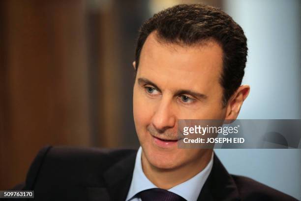 Syrian President Bashar al-Assad gives an exclusive interview to AFP in the capital Damascus on February 11, 2016.