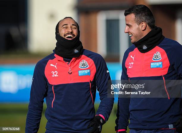 Andros Townsend laughs with teammate Steven Taylor during the Newcastle United Training session at The Newcastle United Training Centre on February...