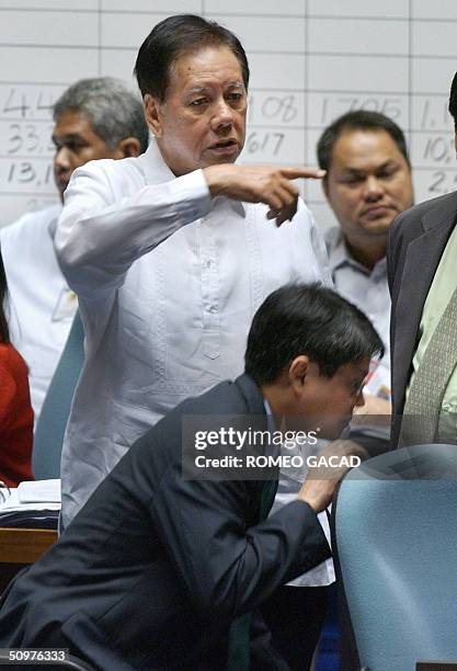 Administration Senator John Osmena gestures as Senator Francisco Pangilinan, chairman of the joint senate and congress presidential canvass committee...