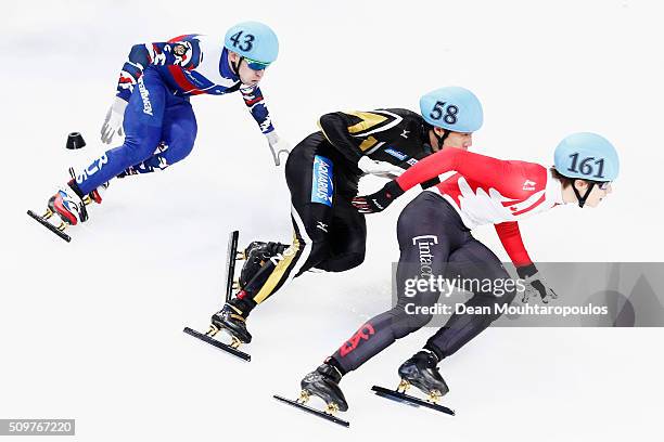 Ruslan Zakharov of Russia, Ryosuke Sakazume of Japan and Alexander Fathoullin of Canada during ISU Short Track Speed Skating World Cup held at The...