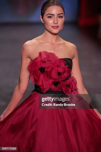 Actress Olivia Culpos wearing Marchesa walks the runway at The American Heart Association's Go Red For Women Red Dress Collection 2016 Presented By...