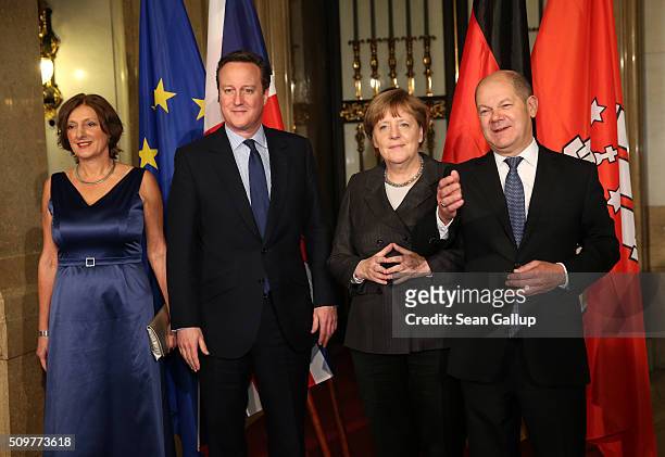 British Prime Minister David Cameron , German Chancellor Angela Merkel Hamburg's Mayor Olaf Scholz and his wife Britta Ernst attend the annual...