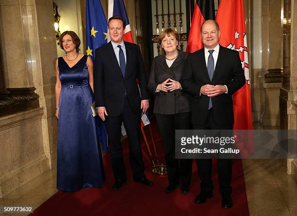 British Prime Minister David Cameron , German Chancellor Angela Merkel Hamburg's Mayor Olaf Scholz and his wife Britta Ernst attend the annual...