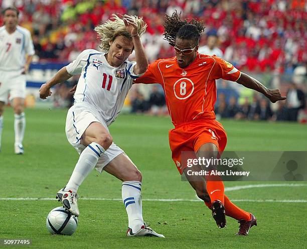 Edgar Davids of Holland clashes with Pavel Nedved of the Czech Rep scores the first goal during the UEFA Euro 2004, Group D match between Holland and...