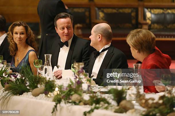 German Social Democrat Carola Veit, British Prime Minister David Cameron, Hamburg Mayor Olaf Scholz and German Chancellor Angela Merkel attend the...