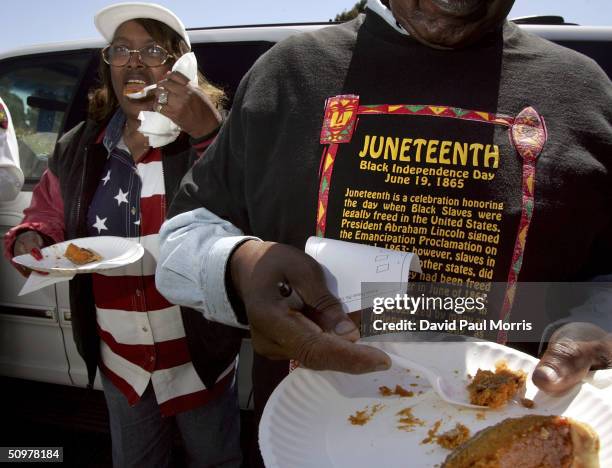 Naomi Williams and D'Emanuel Grosse Sr taste the sweet potato pie entered in the cook-off contest at the Juneteenth, Black Independence Day...