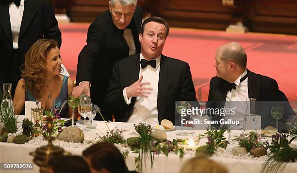 German Social Democrat Carola Veit , British Prime Minister David Cameron and Hamburg Mayor Olaf Scholz attend the annual Matthiae-Mahl dinner at...