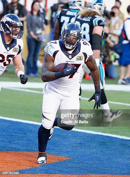 Malik Jackson of the Denver Broncos celebrates with teammates after recovering a fumble for a first quarter touchdown against the Carolina Panthers...
