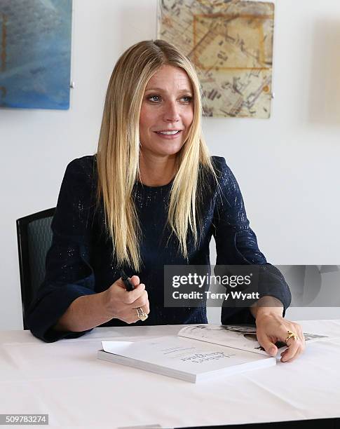 Gwyneth Paltrow signs her book 'It's all Good' during the the 2016 Antiques And Garden Show Of Nashville at Music City Center on February 12, 2016 in...