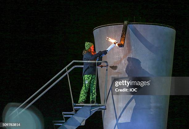 In this handout image supplied by the IOC, Her Royal Highness Princess Ingrid Alexandra of Norway lights the cauldron of Lillehammer 2016 Winter...