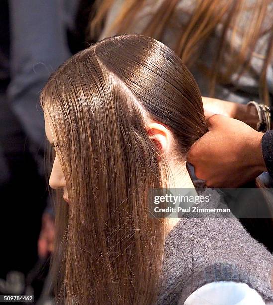 Model prepares backstage at the Zimmermann Backstage Fall 2016 New York Fashion Week at ArtBeam on February 12, 2016 in New York City.