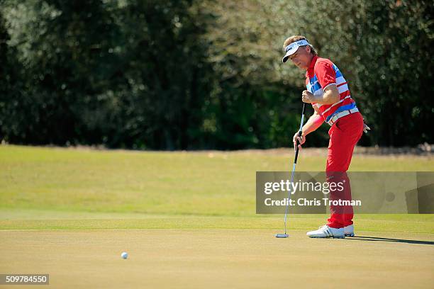 Bernhard Langer of Germany hits a putt on the 8th hole during the first round of the 2016 Chubb Classic at the TwinEagles Club on February 12, 2016...