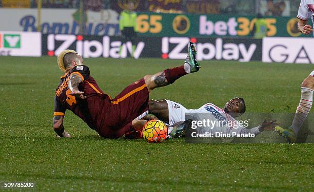 Isaac Cofie of Carpi FC competes with Radja Nainggolan of AS Roma during the Serie A match between Carpi FC and AS Roma at Alberto Braglia Stadium on...