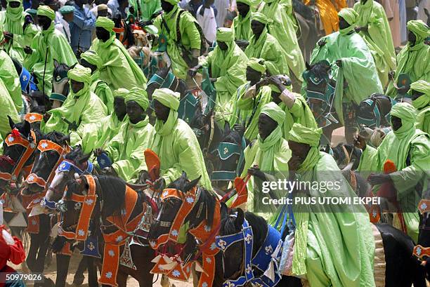 Over a thousand horse riders fill out in procession at Shehu Kangiwa Square 20 June 2004 during a durbar, a traditional spectacle that pays homage to...