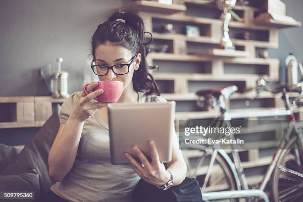 working in a café - pink spectacles stock pictures, royalty-free photos & images