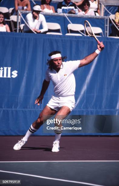 Argentinean tennis player Guillermo Vilas in action on the court, September 1982.