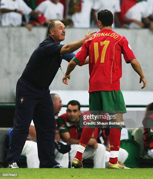Coach Luiz Felipe Scolari of Portugal talks to Cristiano Ronaldo of Portugal during the UEFA Euro 2004 Group A match between Portugal and Spain at...