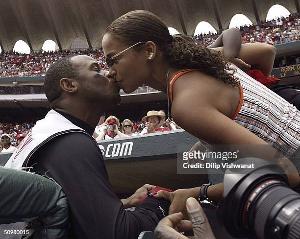 Ken Griffey Jr. #30 of the Cincinnati Reds kisses his wife Melissa after hitting his 500th career home run in the sixth inning against Matt Morris of...