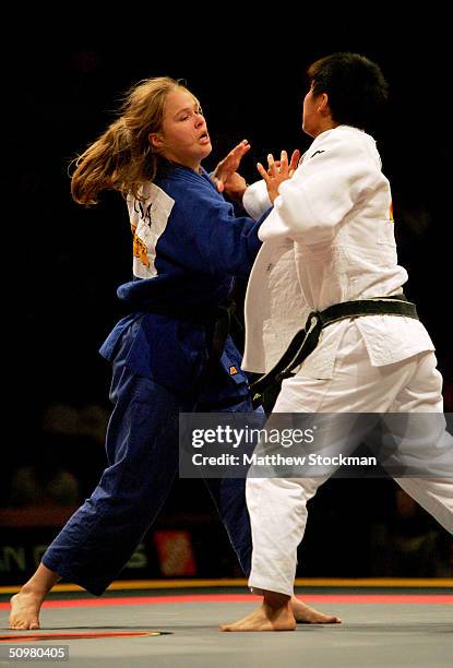 Ronda Rousey fights Shumei Dou of China in the 63 kg judo event during the Titan Games June 20, 2004 at Phillips Arena in Atlanta, Georgia.