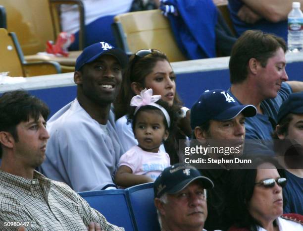 Los Angeles Lakers guard Kobe Bryant attends the game between the New York Yankees and the and the Los Angeles Dodgers with wife Vanessa and daughter...