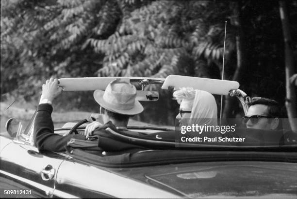 Shortly after their marriage, American actress Marilyn Monroe and American playwright Arthur Miller drive in a convertible with Monroe's close...