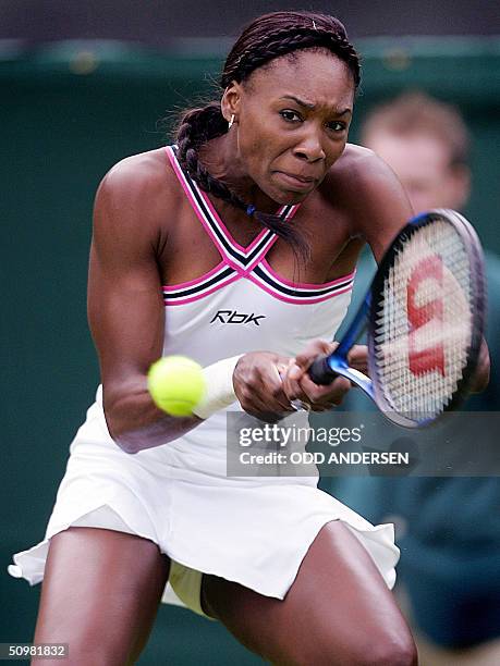 Venus Williams of the us hits a back hand to Marie-Gayane Mikaelian of Switzerland during the first round of the 118th Wimbledon Tennis Championships...
