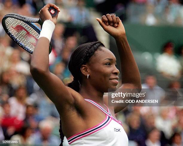 Venus Williams of the US celebrates her win over Marie-Gayane Mikaelian of Switzerland during the first round of the 118th Wimbledon Tennis...