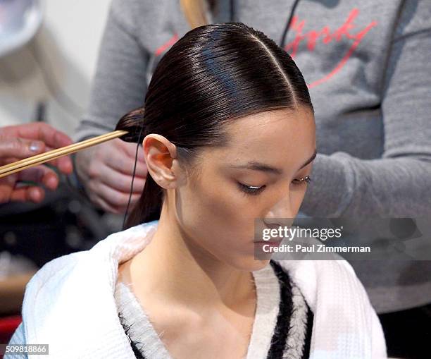 Model prepares backstage at the Zimmermann - Front Row & Backstage - Fall 2016 New York Fashion Week at ArtBeam on February 12, 2016 in New York City.
