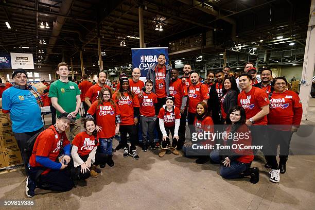 Isaiah Austin takes a picture with volunteers during the NBA Cares All-Star Day of Service as part of 2016 All-Star Weekend at NBA Centre Court of...